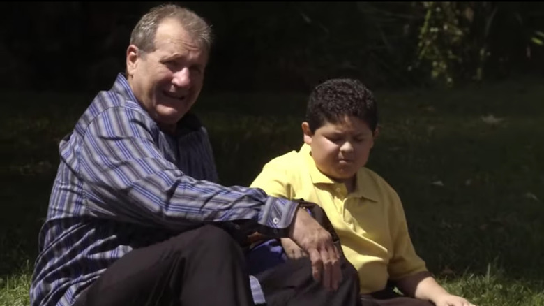 Jay and Manny sitting in yard