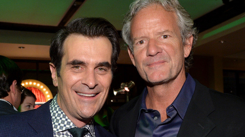 Christopher Lloyd and Ty Burrell smile at event 