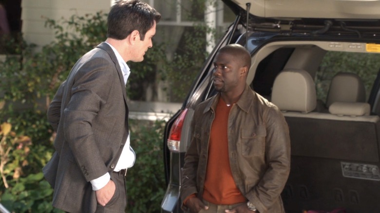 Phil and Andre standing in front of car 