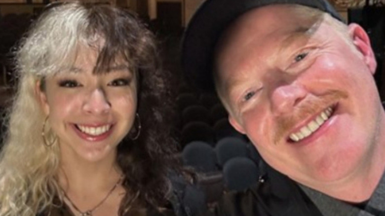 Aubrey Anderson-Emmons smiling with Jesse Tyler Ferguson