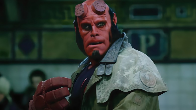 Hellboy standing on subway platform