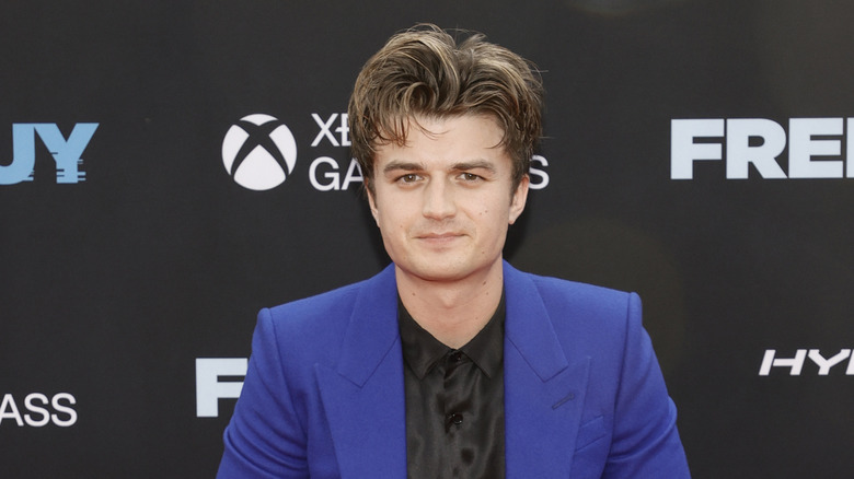 Joe Keery staring