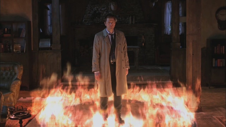 Castiel standing in fire circle