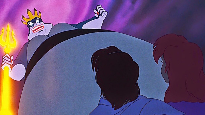 Ursula looming over Ariel and Prince Eric