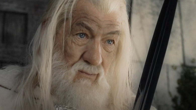 Gandalf holds sword