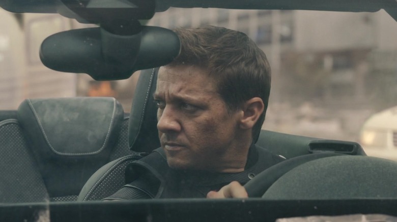 Hawkeye behind the wheel of a car