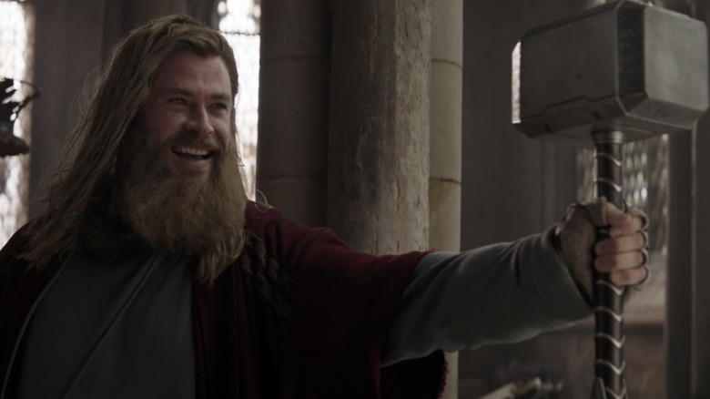 Thor smiling with Mjolnir