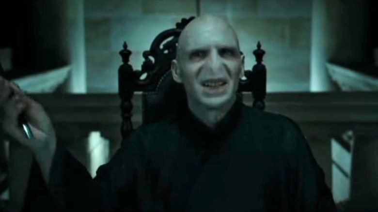 Voldemort snickers before delivering a fatal blow.