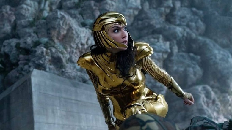 Diana kneeling in gold armor