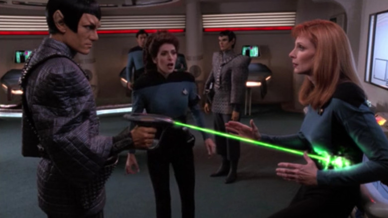 Dr. Crusher is shot by a Romulan