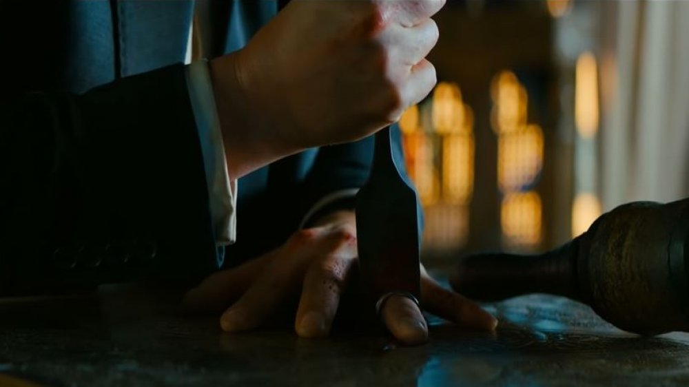 John Wick slicing his finger off