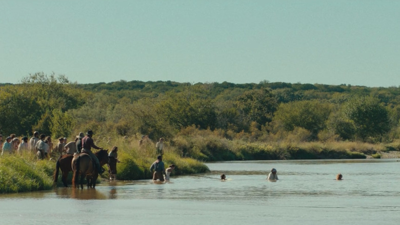 The group crosses a river