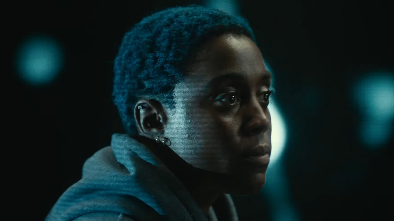 Lashana Lynch giving a speech