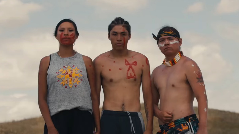 Lakota youths wearing traditional makeup