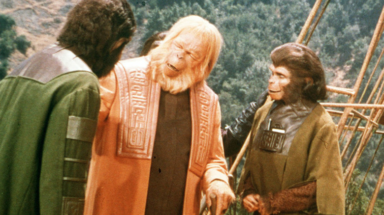 Dr. Zaius chats with fellow apes