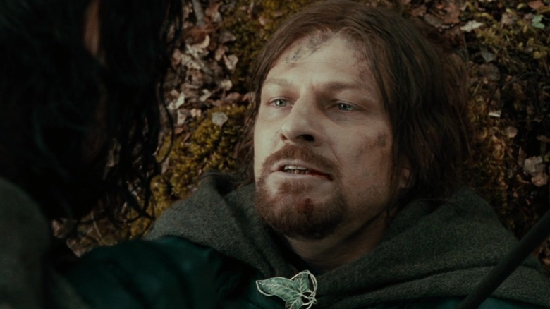 Boromir lays dying below Aragorn