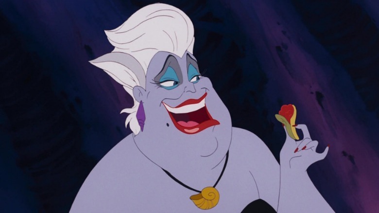 Ursula applying lipstick