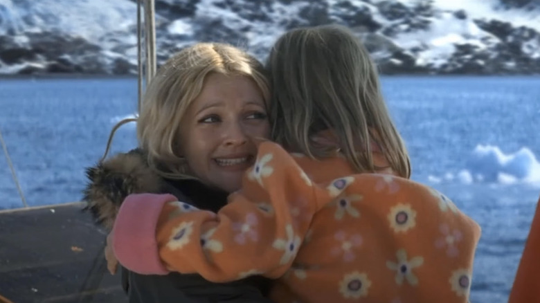 Drew Barrymore hugging child on boat