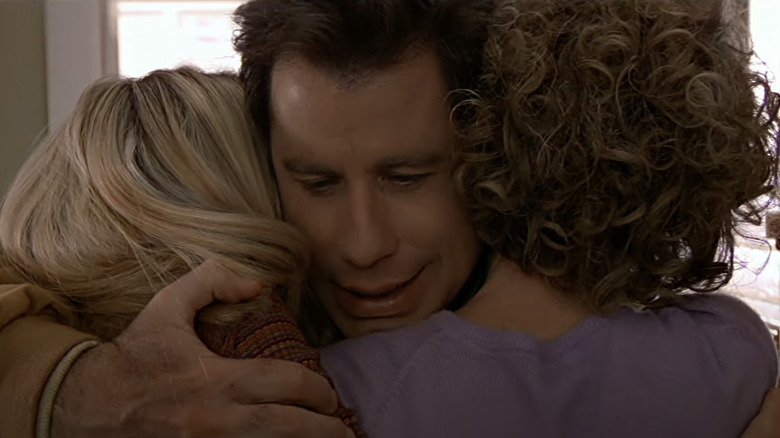 John Travolta hugging family