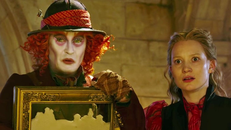 The Mad Hatter and Alice look worried