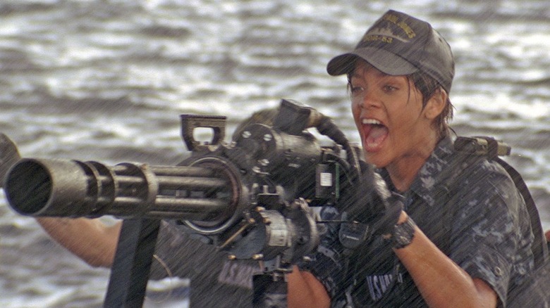 Cora Raikes yells behind gun in rain