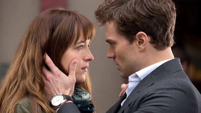 Ana and Christian stare into each others eyes in "Fifty Shades" (2015)