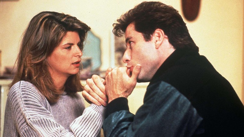 James kisses Molly's hand in "Look Who's Talking" (1989)