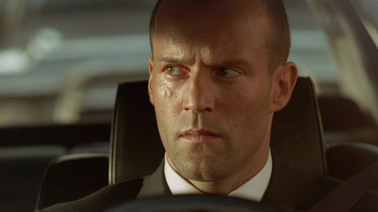 Frank Martin sits behind the wheel in "The Transporter" (2002)