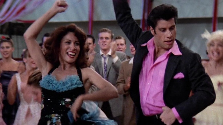 John Travolta and woman dance