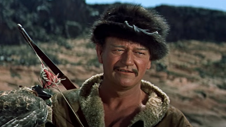 John Wayne in furry hat with bird 