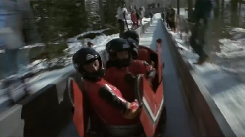 Bobsledders race down track