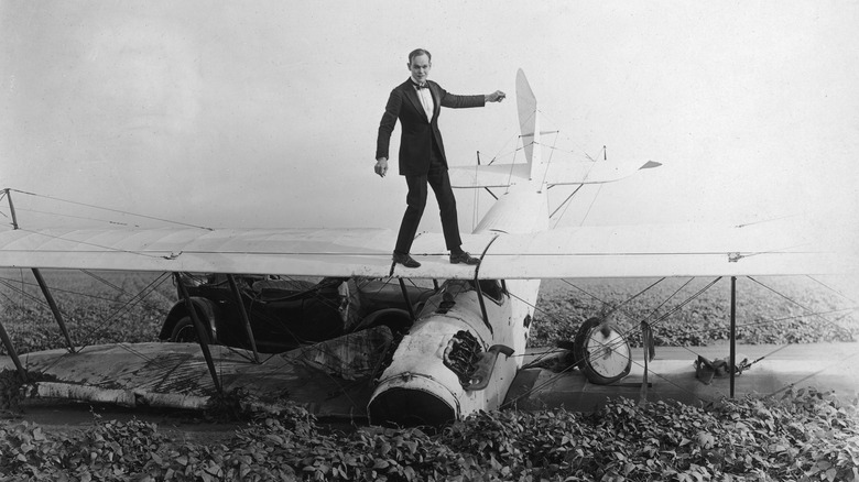 Captain Norman standing on plane