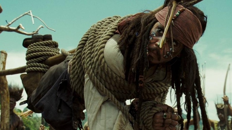 Captain Jack Sparrow is bound with rope