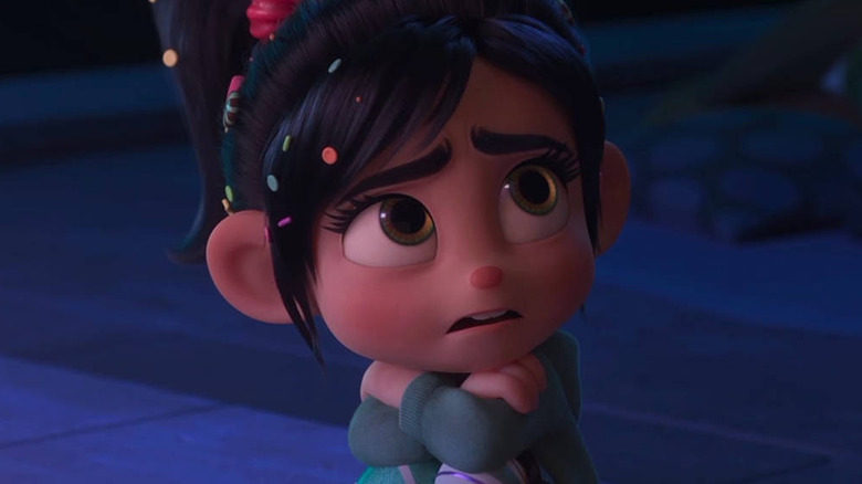 Vanellope sitting on curb