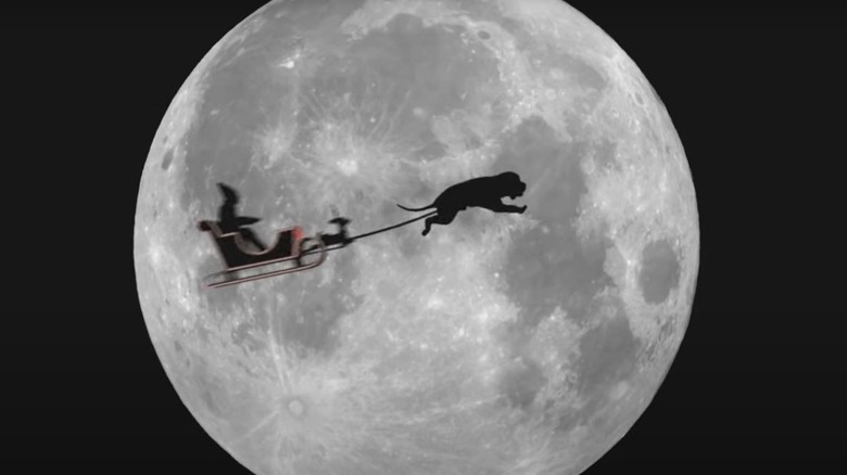 Dog flying Santa's sleigh