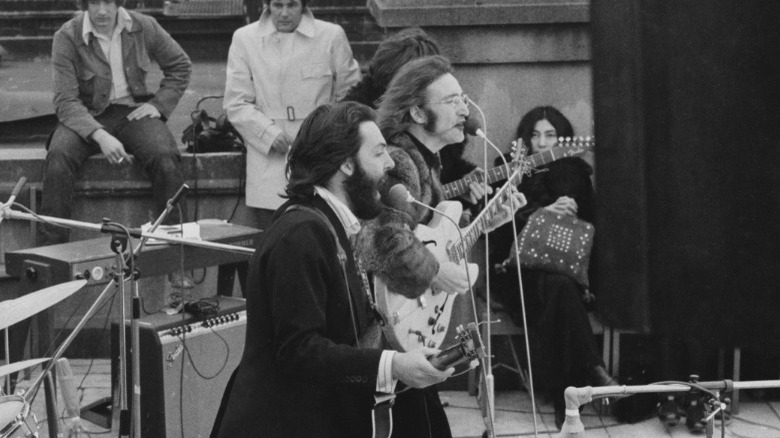 The Beatles performing on a rooftop