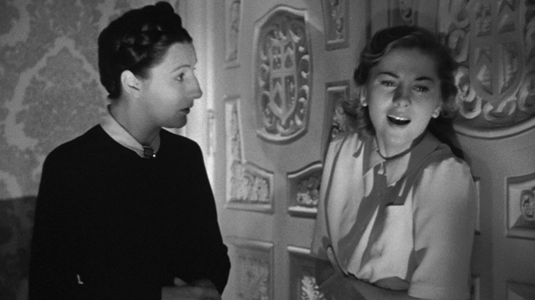 Joan Fontaine laughing in her home