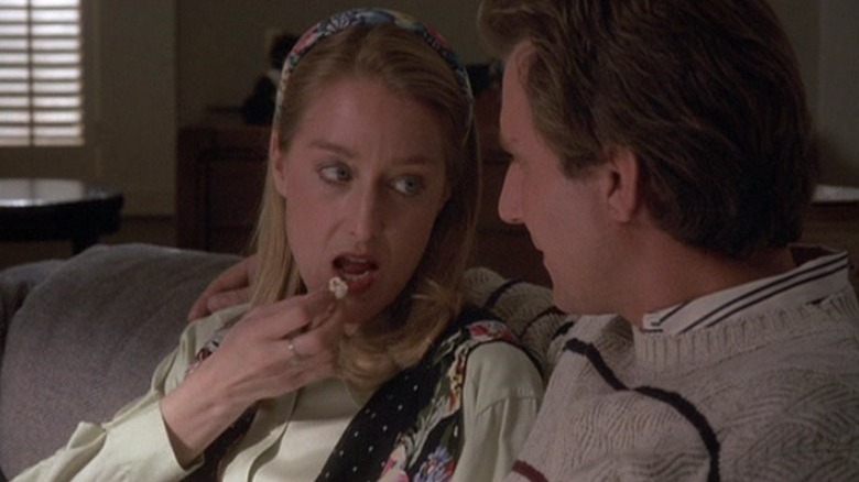 Timothy Carhart and Patricia Wettig eating popcorn