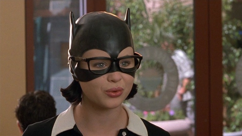 Enid wearing glasses and Batman mask