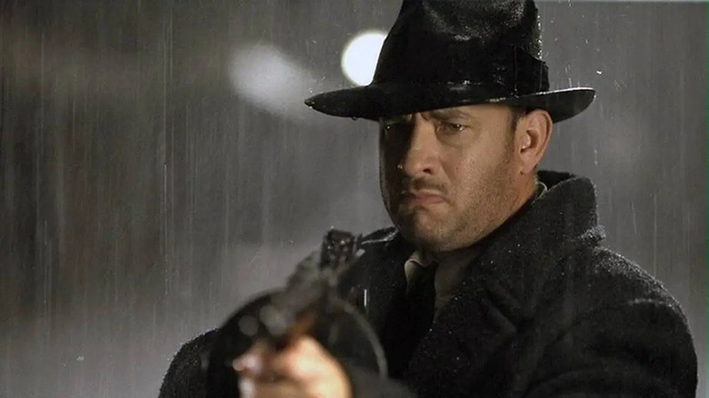 Michael aims tommy gun in the rain