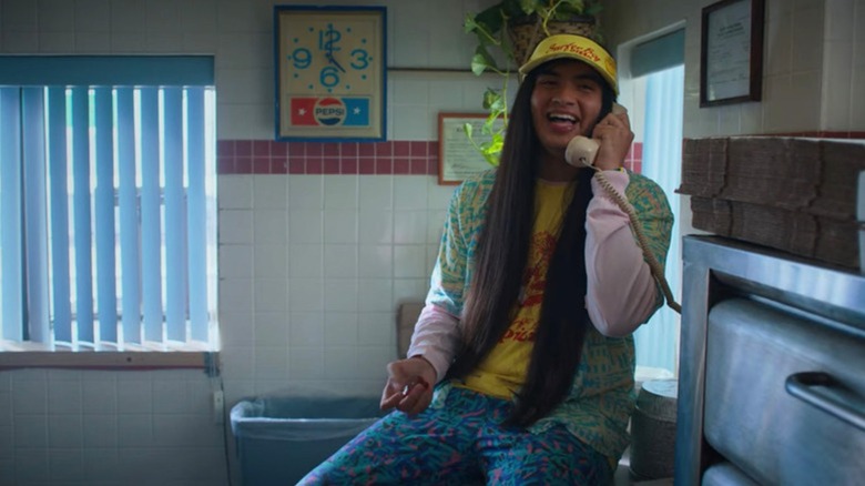 Argylle talks on the phone in his pizza shop in "Stranger Things"