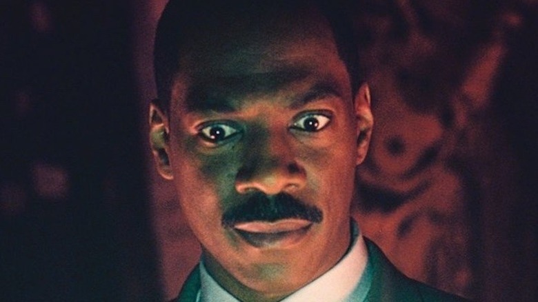 Eddie Murphy looks down