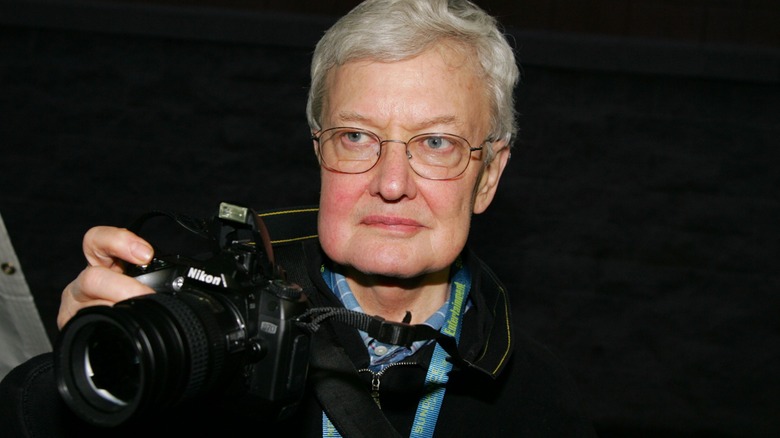 Roger Ebert holding camera