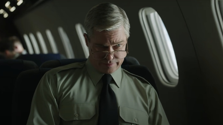 McMahon sitting in airplane in War Machine