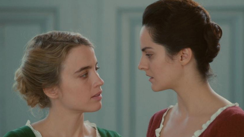 Adele Haenel and Noemie Merlant gaze intensely 