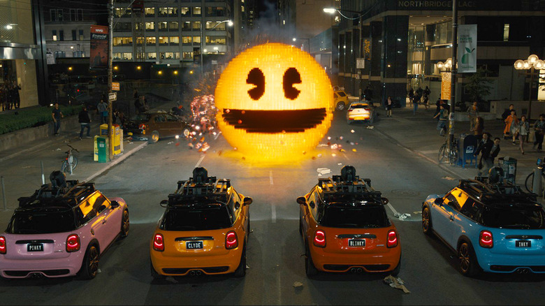 Four cars facing giant pacman