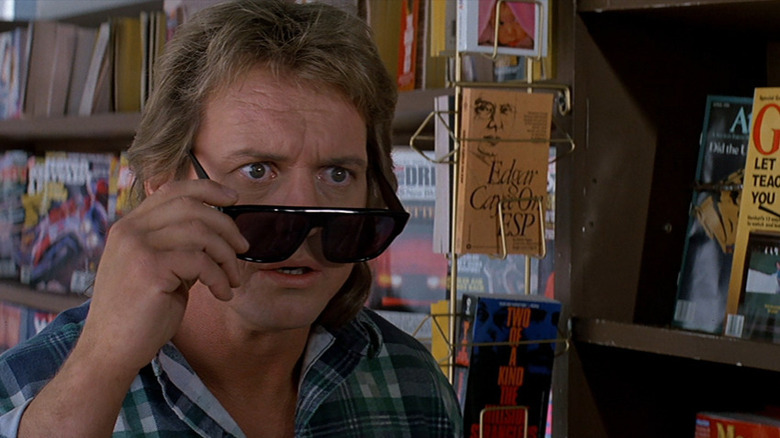 Roddy Piper pulling sunglasses down