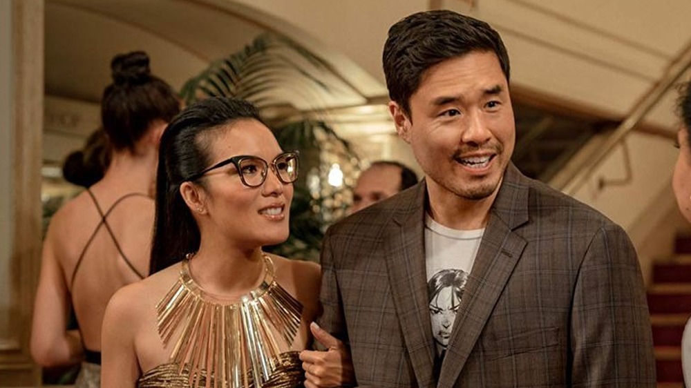 Ali Wong and Randall Park stand arm in arm