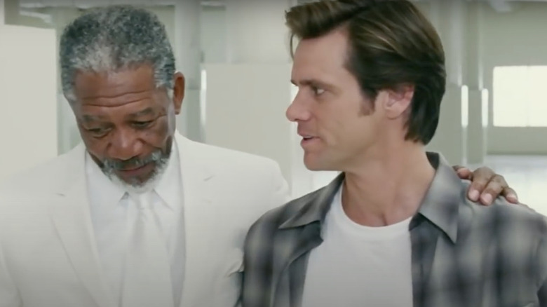 Morgan Freeman's arm around Jim Carrey.