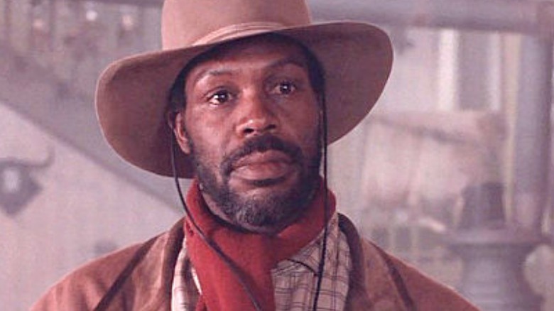 Silverado Danny Glover wears a hat